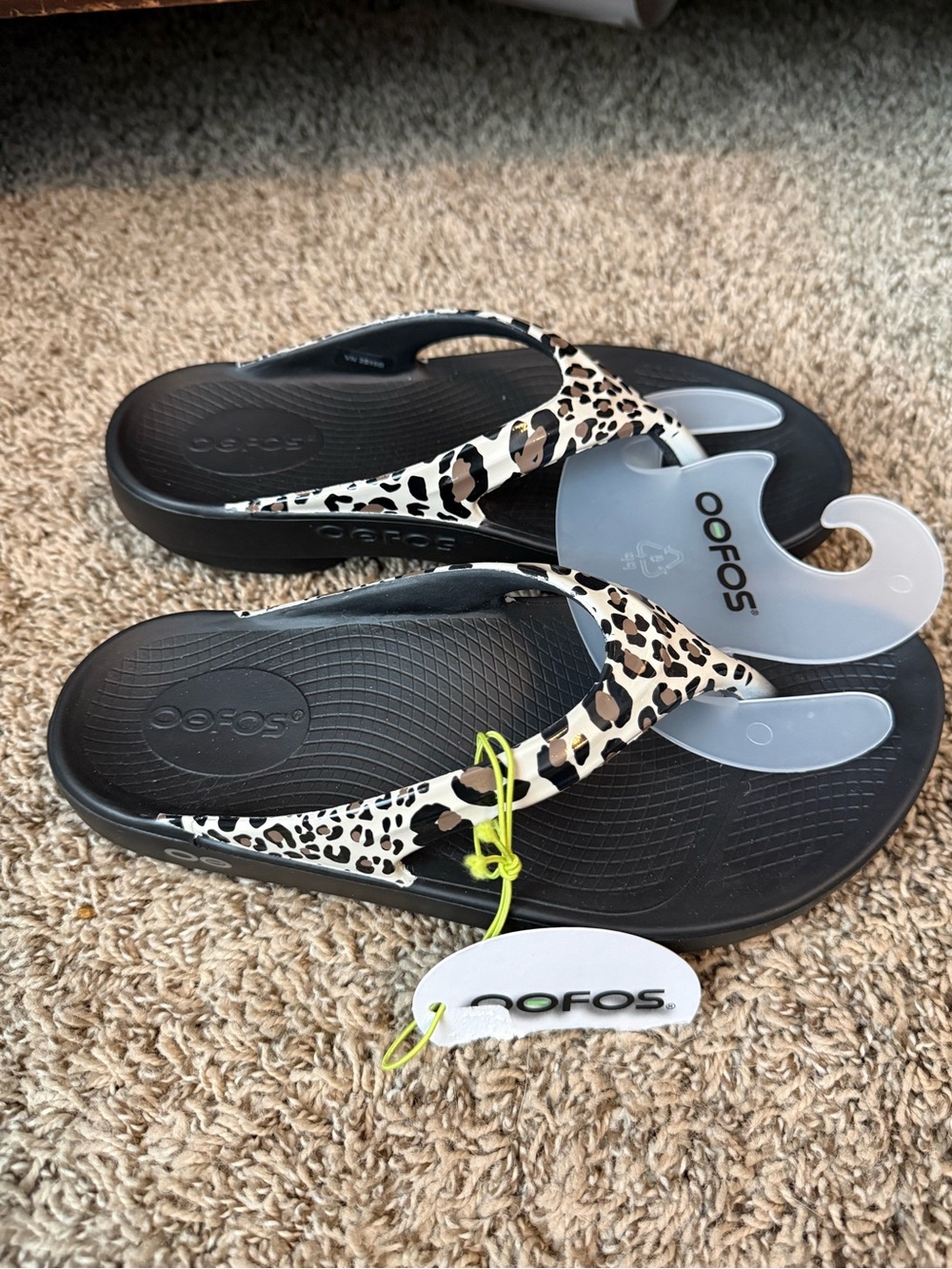 OOFOS Women's Leopard Print Black Flip Flop Sandals with Beige Accents